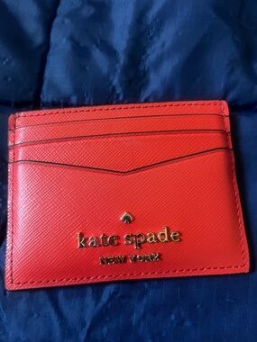 kate spade red leather card case with gold logo